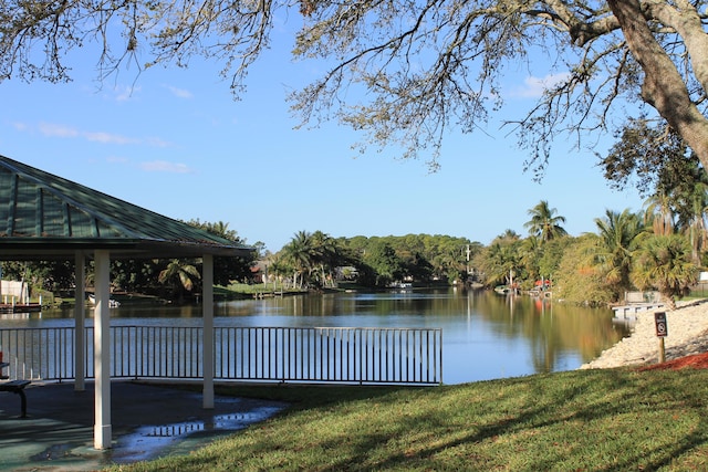 view of dock featuring a water view and a gazebo