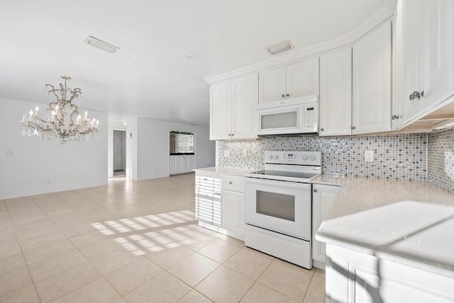 kitchen featuring light tile patterned flooring, white appliances, visible vents, white cabinets, and tasteful backsplash