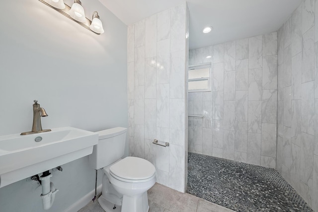 bathroom featuring tile patterned flooring, walk in shower, and toilet