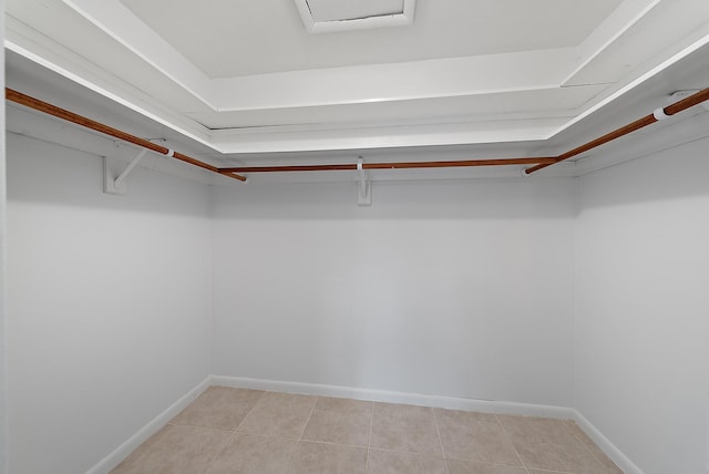 walk in closet featuring light tile patterned floors
