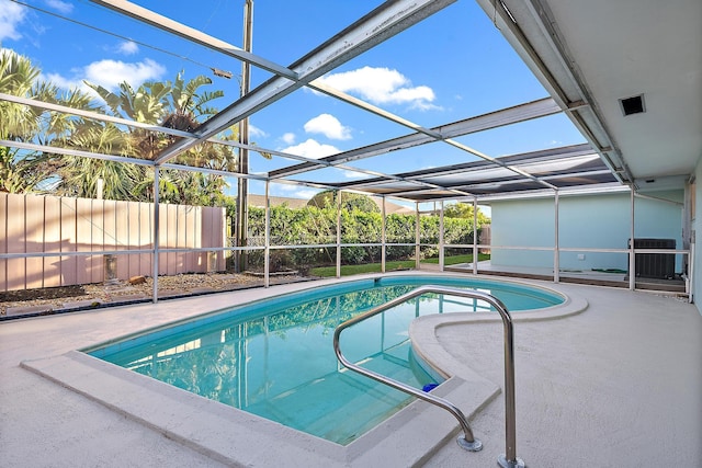 outdoor pool featuring central AC unit, glass enclosure, a patio area, and fence