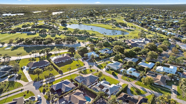bird's eye view with a residential view, a water view, and golf course view