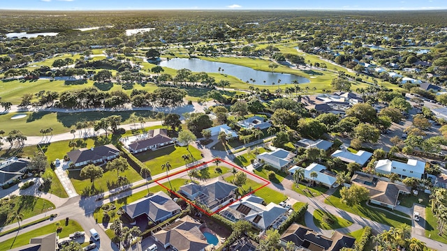 birds eye view of property featuring a water view, view of golf course, and a residential view