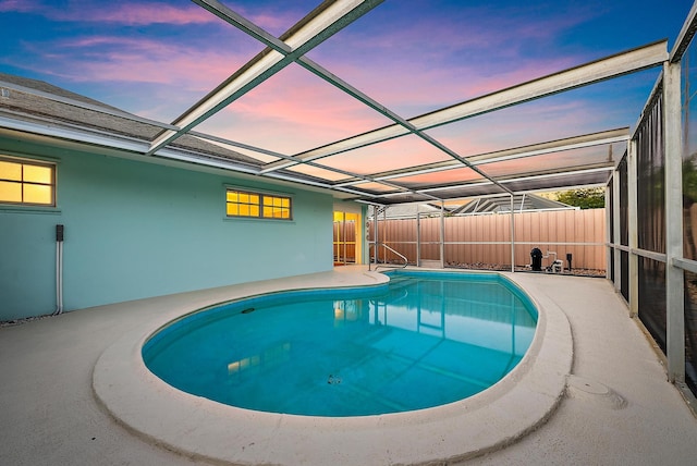 view of pool featuring a patio, fence, a fenced in pool, and a lanai