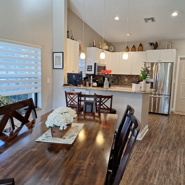 dining room featuring recessed lighting, visible vents, and dark wood finished floors