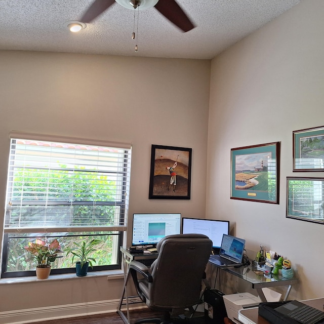 office featuring a textured ceiling and ceiling fan
