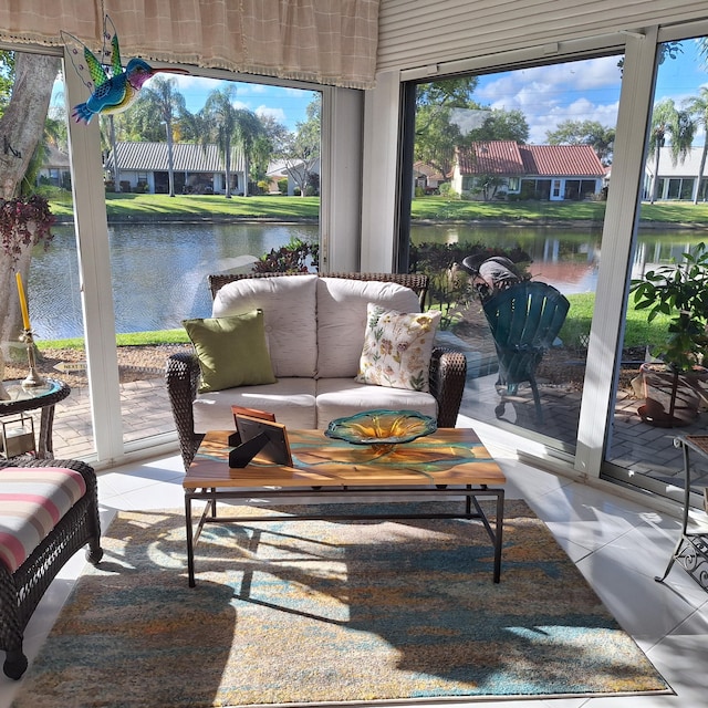 sunroom / solarium with a water view