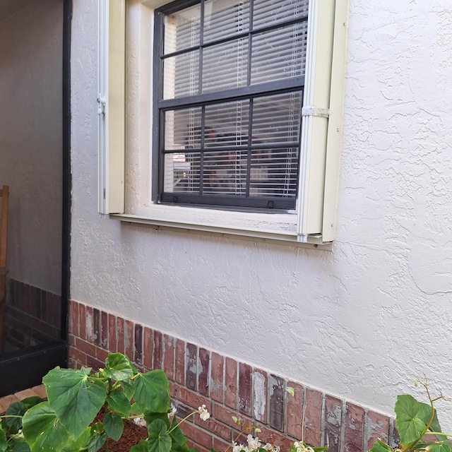 exterior details featuring stucco siding