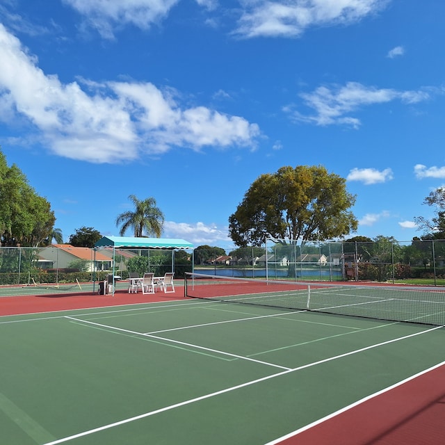 view of sport court featuring community basketball court and fence