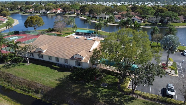 birds eye view of property with a water view and a residential view
