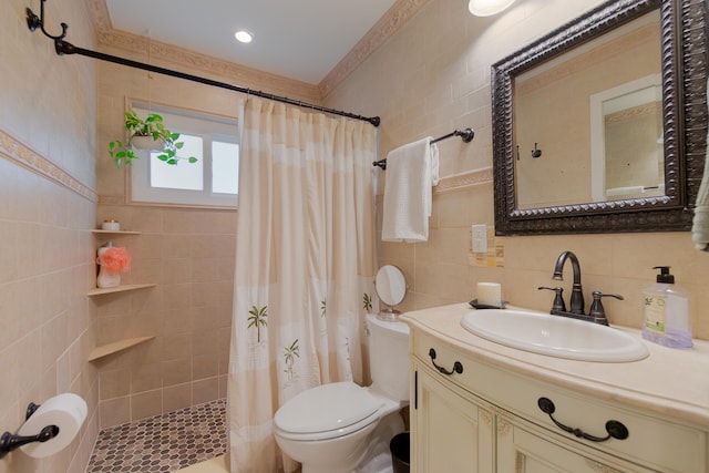 bathroom featuring tile walls, tiled shower, toilet, vanity, and backsplash