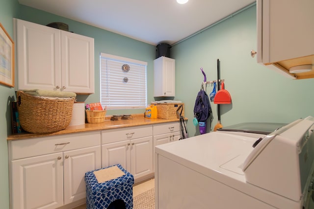 laundry area featuring washer and dryer and cabinet space