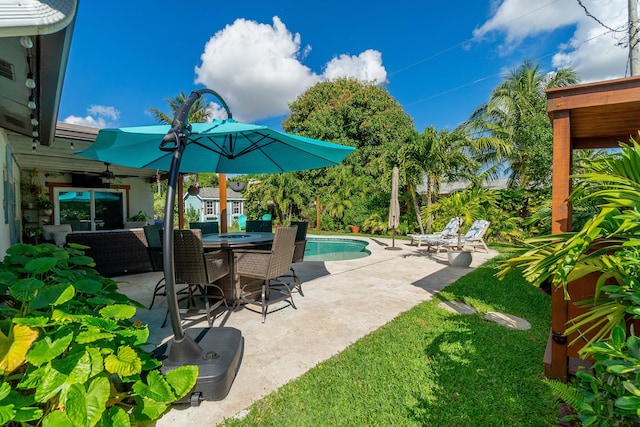 view of patio featuring an outdoor pool and outdoor dining space