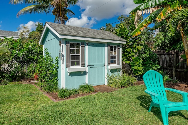 view of shed with fence