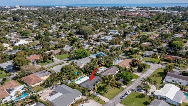 birds eye view of property with a residential view