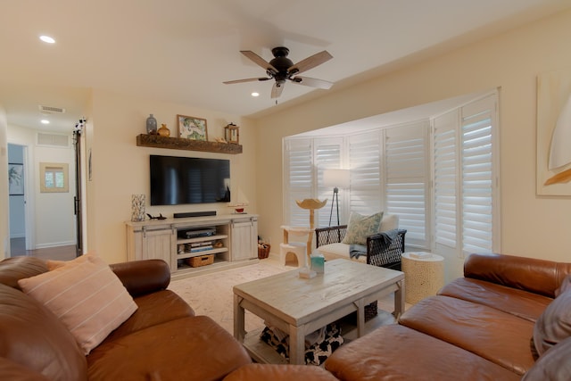 living room with baseboards, visible vents, a ceiling fan, and recessed lighting