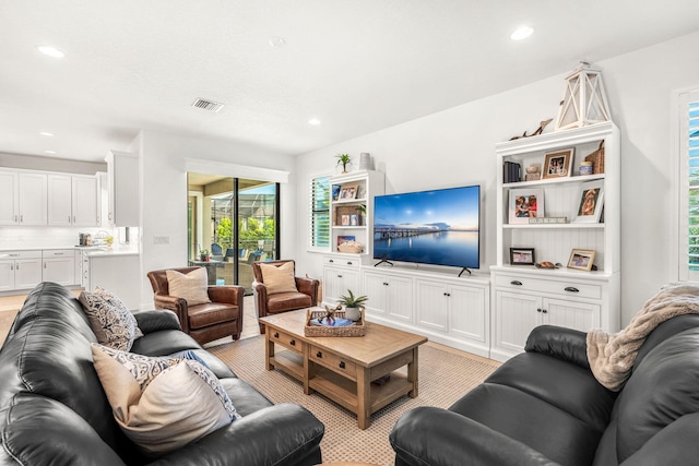 living room with visible vents and recessed lighting