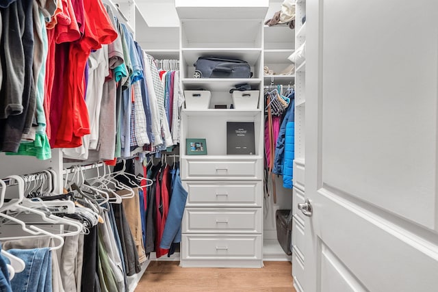 spacious closet with light wood finished floors