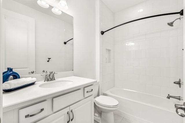 bathroom with toilet, bathing tub / shower combination, vanity, and tile patterned floors