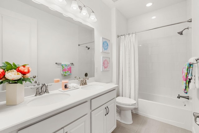 full bathroom featuring toilet, shower / bathtub combination with curtain, double vanity, and a sink