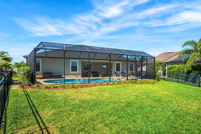 back of property featuring a yard, a fenced backyard, a fenced in pool, and a lanai