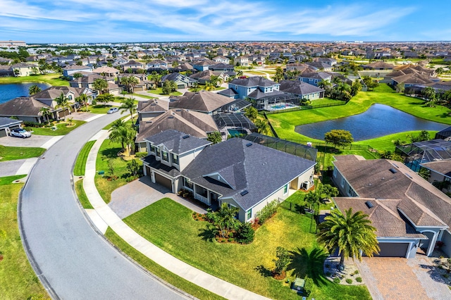 birds eye view of property featuring a residential view and a water view