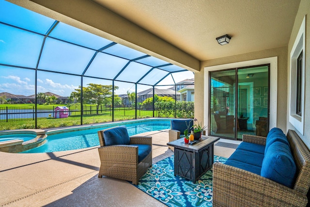 view of pool featuring a lanai, a patio area, a pool with connected hot tub, and outdoor lounge area