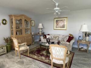 living area with ceiling fan