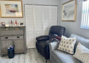 sitting room with light wood-style floors