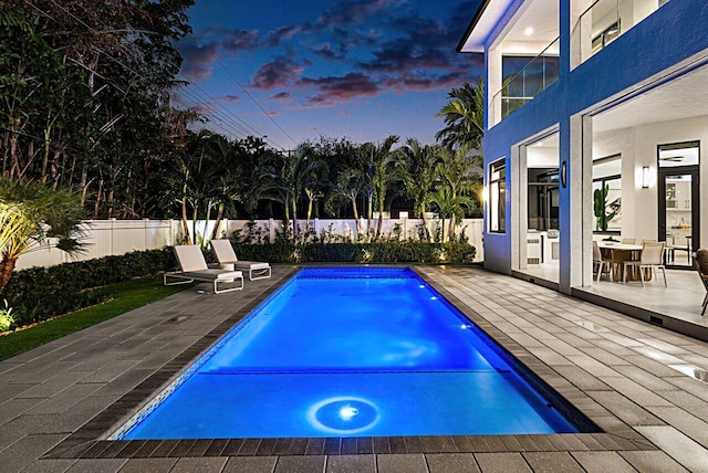 view of swimming pool with a patio area, a fenced backyard, and a fenced in pool