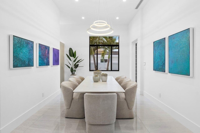 dining space with a notable chandelier, recessed lighting, and baseboards