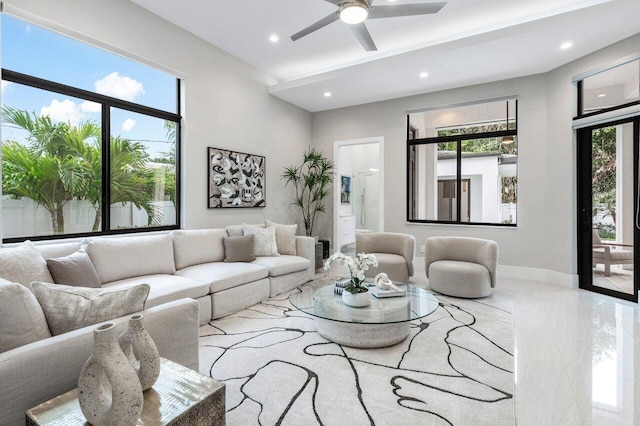 living room with ceiling fan, baseboards, and recessed lighting