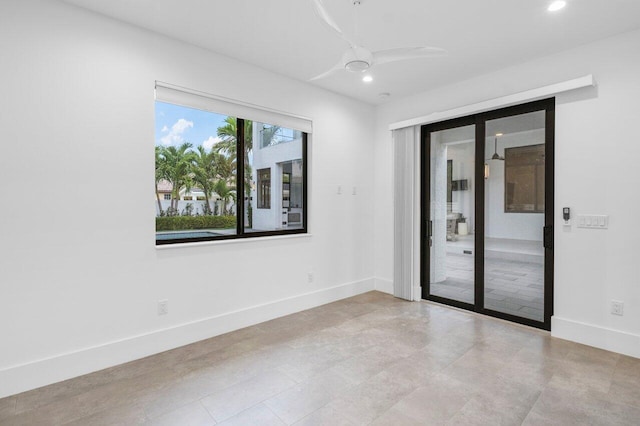 empty room featuring recessed lighting, ceiling fan, and baseboards