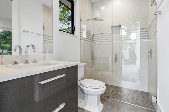 full bathroom with toilet, a stall shower, tile patterned flooring, and vanity