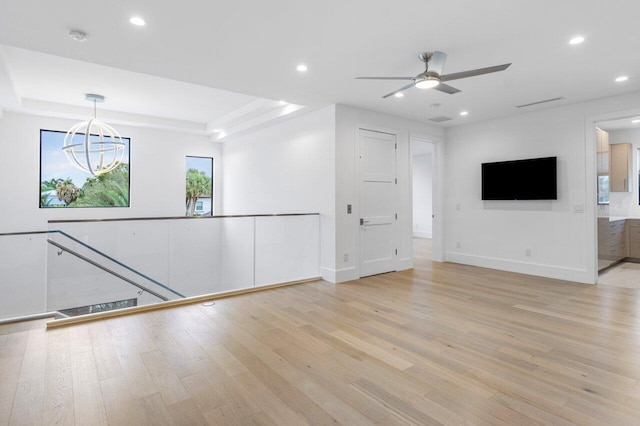 interior space with a ceiling fan, recessed lighting, light wood-style flooring, and baseboards