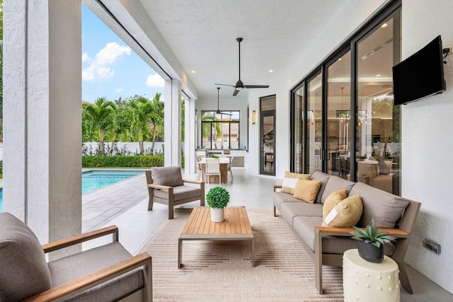 sunroom with ceiling fan