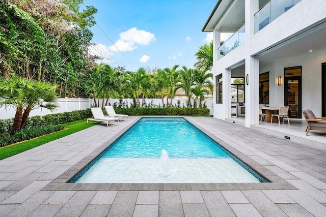 view of swimming pool with a fenced in pool, a patio area, and fence