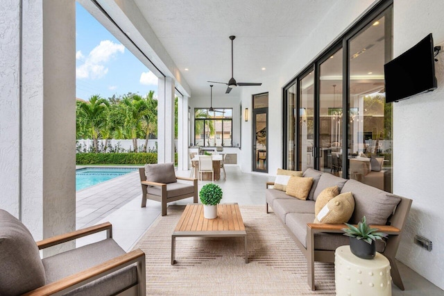 sunroom with ceiling fan