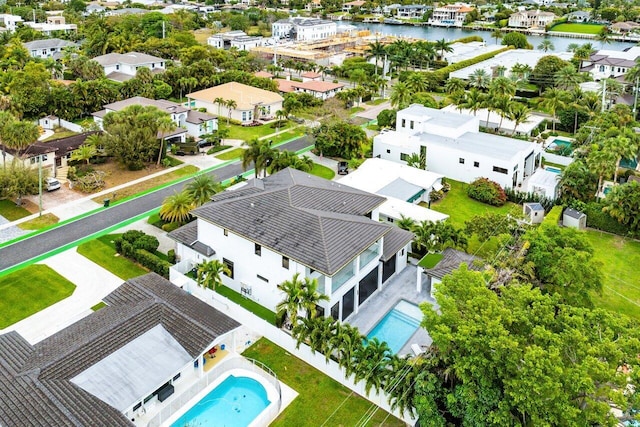 bird's eye view featuring a water view and a residential view