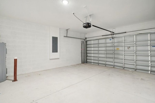 garage featuring electric panel and a garage door opener