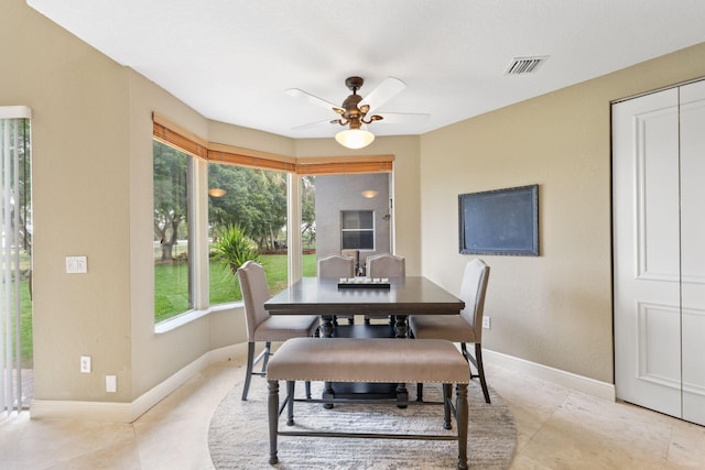 dining area with visible vents, ceiling fan, and baseboards