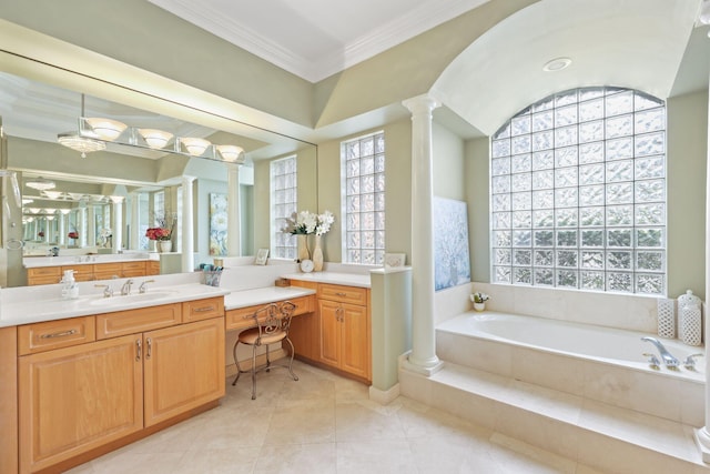 bathroom featuring ornamental molding, tile patterned floors, vanity, ornate columns, and a bath