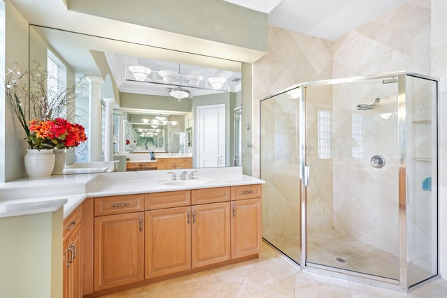 full bath featuring a stall shower, vanity, and crown molding