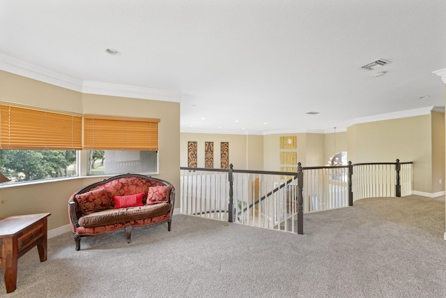 living area featuring visible vents, baseboards, ornamental molding, carpet, and an upstairs landing