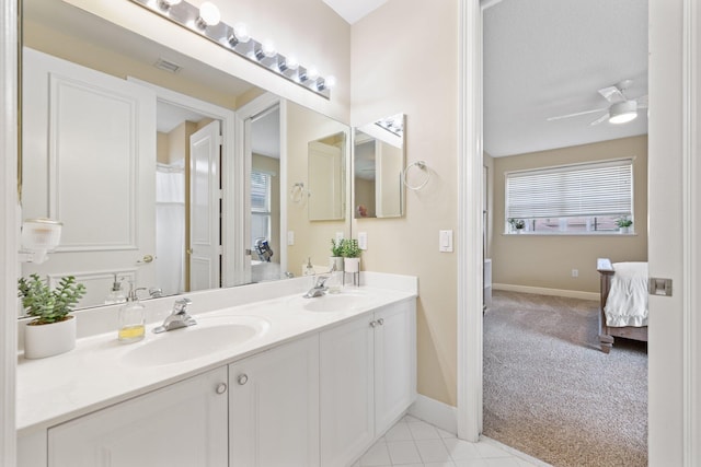 full bath featuring a ceiling fan, visible vents, a sink, and double vanity