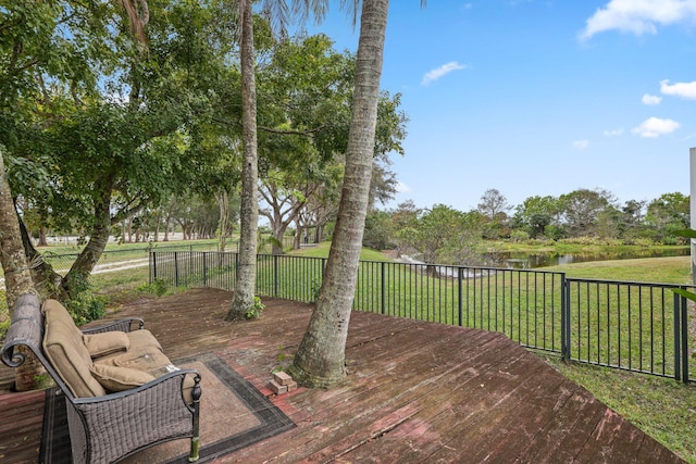 wooden terrace with a yard