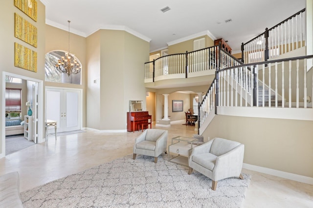 entryway featuring ornate columns, a high ceiling, stairway, and baseboards