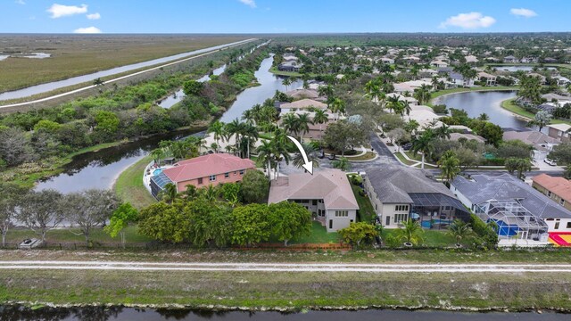 bird's eye view featuring a water view and a residential view