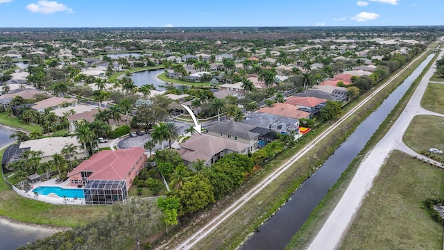 bird's eye view with a water view and a residential view