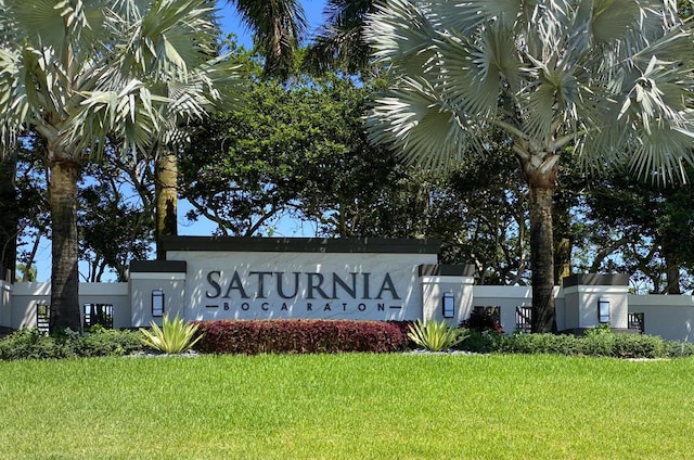 community / neighborhood sign featuring a lawn